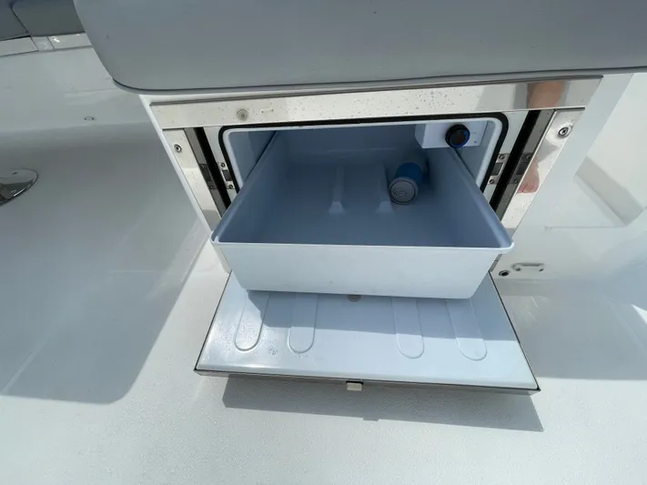 Almost Spoiled 1 Yacht Photos Pics Open storage compartment on 2020 Sunseeker 74 Sport Yacht with a small item inside.