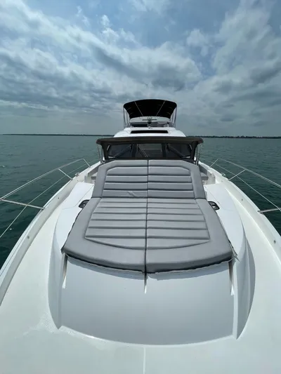 Almost Spoiled 1 Yacht Photos Pics Sunseeker 74 Sport Yacht 2020 on open water, featuring sleek design and spacious deck.