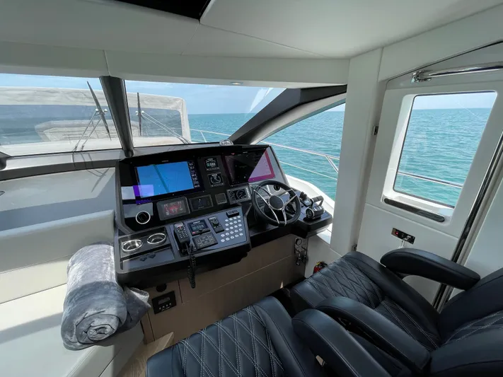 Almost Spoiled 1 Yacht Photos Pics Interior helm of 2020 Sunseeker 74 Sport Yacht with ocean view.
