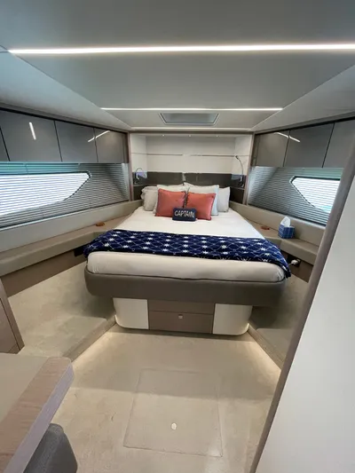 Almost Spoiled 1 Yacht Photos Pics Luxurious bedroom interior of 2020 Sunseeker 74 Sport Yacht with modern design and cozy decor.