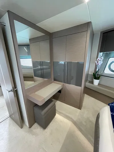 Almost Spoiled 1 Yacht Photos Pics Luxurious interior of 2020 Sunseeker 74 Sport Yacht with modern vanity and elegant decor.