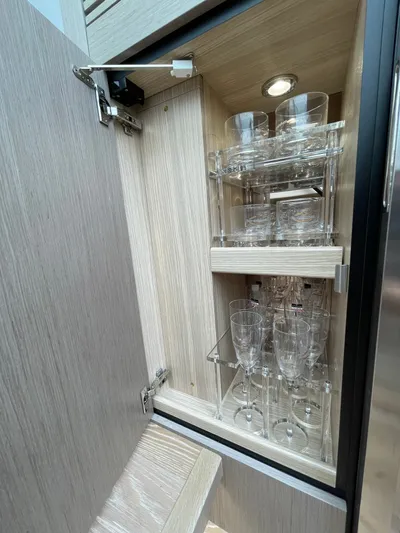 Almost Spoiled 1 Yacht Photos Pics Cabinet with glassware inside a 2020 Sunseeker 74 Sport Yacht.