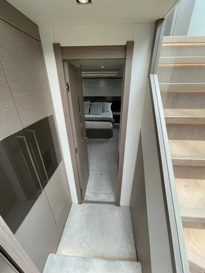 Almost Spoiled 1 Yacht Photos Pics Interior of 2020 Sunseeker 74 Sport Yacht, featuring modern hallway and bedroom view.
