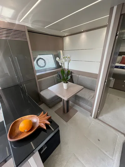 Almost Spoiled 1 Yacht Photos Pics Interior of 2020 Sunseeker 74 Sport Yacht with modern dining area and sleek design.
