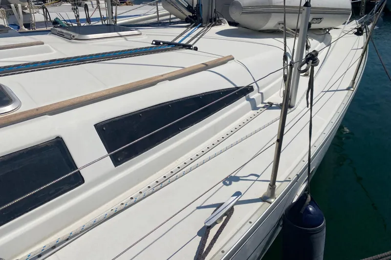  Yacht Photos Pics 2002 Jeanneau Sun Odyssey 40 sailboat deck with rigging and fenders.