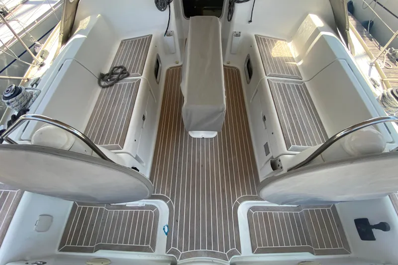  Yacht Photos Pics Cockpit of 2002 Jeanneau Sun Odyssey 40 sailboat with teak flooring and seating.