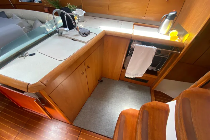  Yacht Photos Pics Interior view of 2002 Jeanneau Sun Odyssey 40 yacht kitchen area.