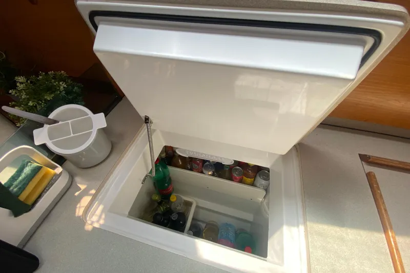  Yacht Photos Pics Interior view of Jeanneau Sun Odyssey 40 yacht's kitchen with open fridge, 2002 model.