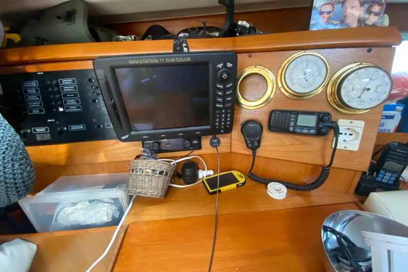  Yacht Photos Pics Navigation station on a 2002 Jeanneau Sun Odyssey 40 sailboat with instruments and controls.