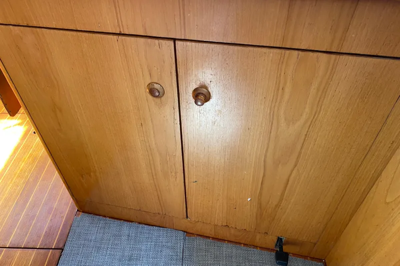  Yacht Photos Pics Wooden cabinet doors inside a 2002 Jeanneau Sun Odyssey 40 sailboat.