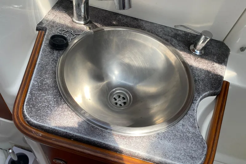  Yacht Photos Pics Stainless steel sink in 2002 Jeanneau Sun Odyssey 40 yacht bathroom.