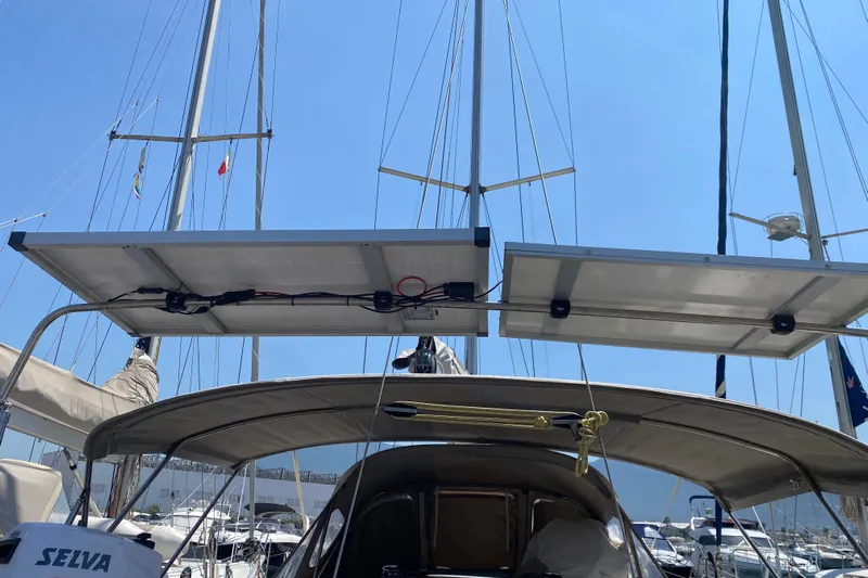  Yacht Photos Pics Jeanneau Sun Odyssey 40 sailboat with solar panels, docked in a marina, 2002 model.