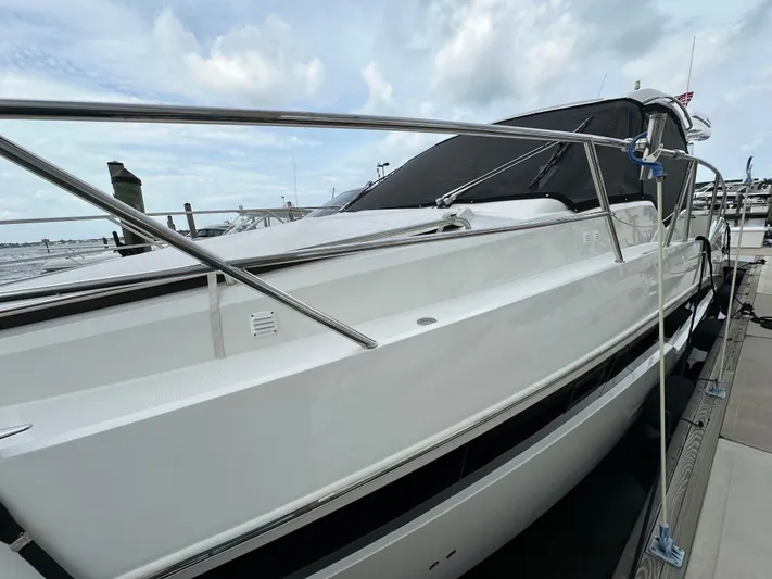 Stelyn Time Yacht Photos Pics 2021 Galeon 425HTS yacht docked, sleek white exterior, modern design, cloudy sky backdrop.