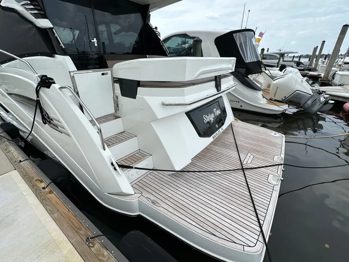 Stelyn Time Yacht Photos Pics 2021 Galeon 425HTS yacht docked, featuring sleek design and spacious deck area.