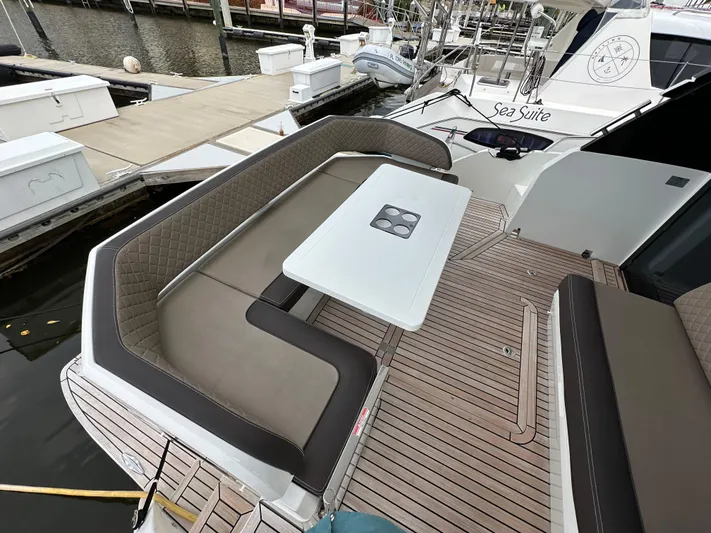 Stelyn Time Yacht Photos Pics Luxury seating area on 2021 Galeon 425HTS yacht, featuring elegant design and dockside view.