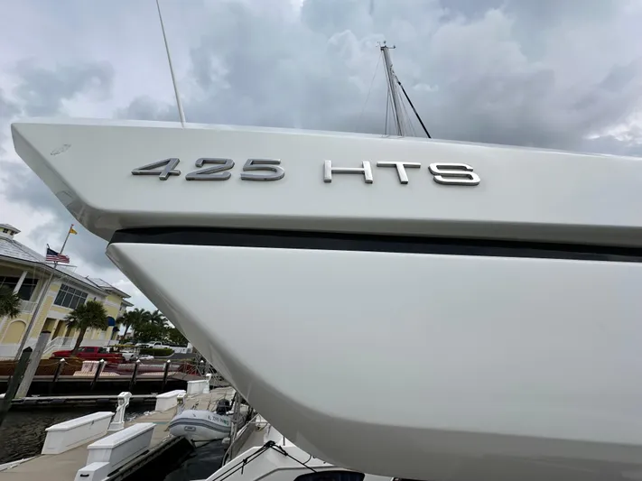 Stelyn Time Yacht Photos Pics Galeon 425HTS yacht, 2021 model, docked under cloudy skies.