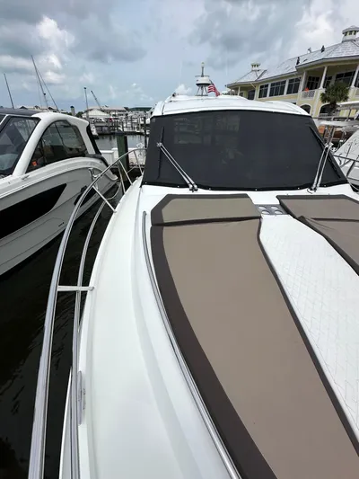 Stelyn Time Yacht Photos Pics 2021 Galeon 425HTS yacht docked at marina under cloudy sky.