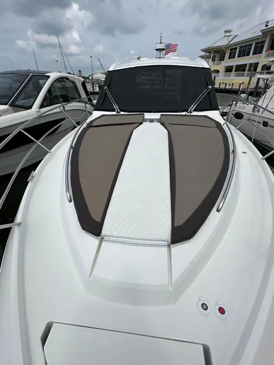 Stelyn Time Yacht Photos Pics 2021 Galeon 425HTS yacht with sleek design, docked at marina under cloudy sky.