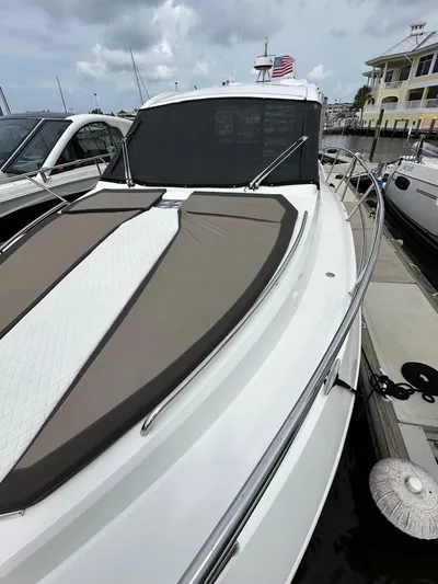 Stelyn Time Yacht Photos Pics 2021 Galeon 425HTS yacht docked, featuring sleek design and sunbathing area.