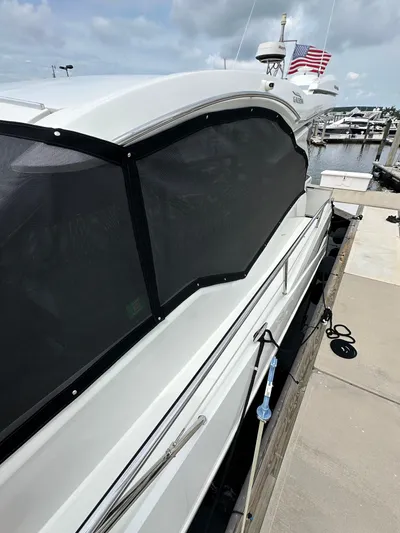 Stelyn Time Yacht Photos Pics 2021 Galeon 425HTS yacht docked at marina, featuring sleek design and tinted windows.
