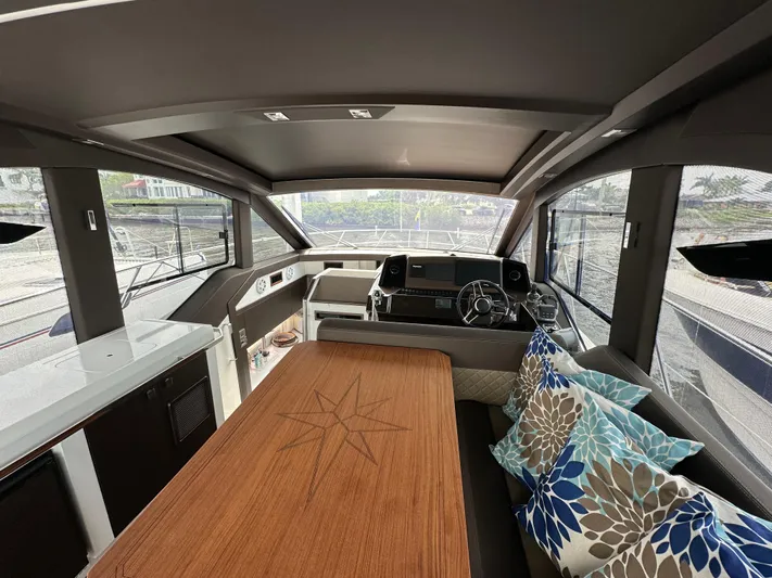 Stelyn Time Yacht Photos Pics Luxurious interior of 2021 Galeon 425HTS yacht with elegant seating and helm.