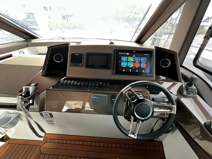 Stelyn Time Yacht Photos Pics Helm of 2021 Galeon 425HTS yacht with modern controls and touchscreen display.