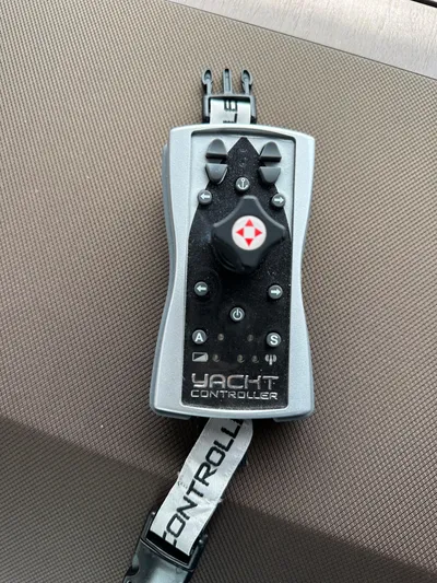 Stelyn Time Yacht Photos Pics Remote control for Galeon 425HTS yacht, 2021 model, on a textured surface.