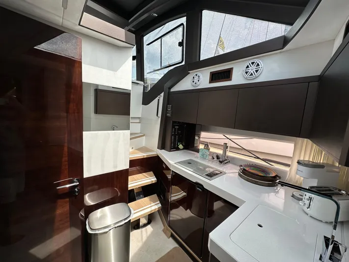 Stelyn Time Yacht Photos Pics Modern kitchen interior of 2021 Galeon 425HTS yacht with sleek cabinetry and appliances.