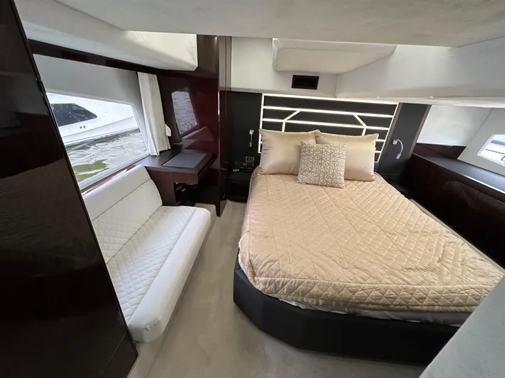 Stelyn Time Yacht Photos Pics Luxurious cabin interior of 2021 Galeon 425HTS yacht with bed and seating area.