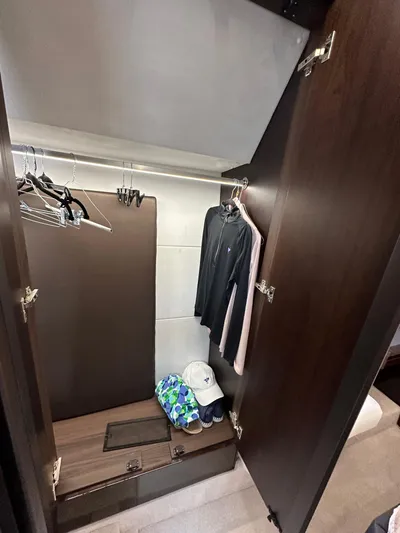 Stelyn Time Yacht Photos Pics Closet interior on 2021 Galeon 425HTS yacht with clothes and accessories.
