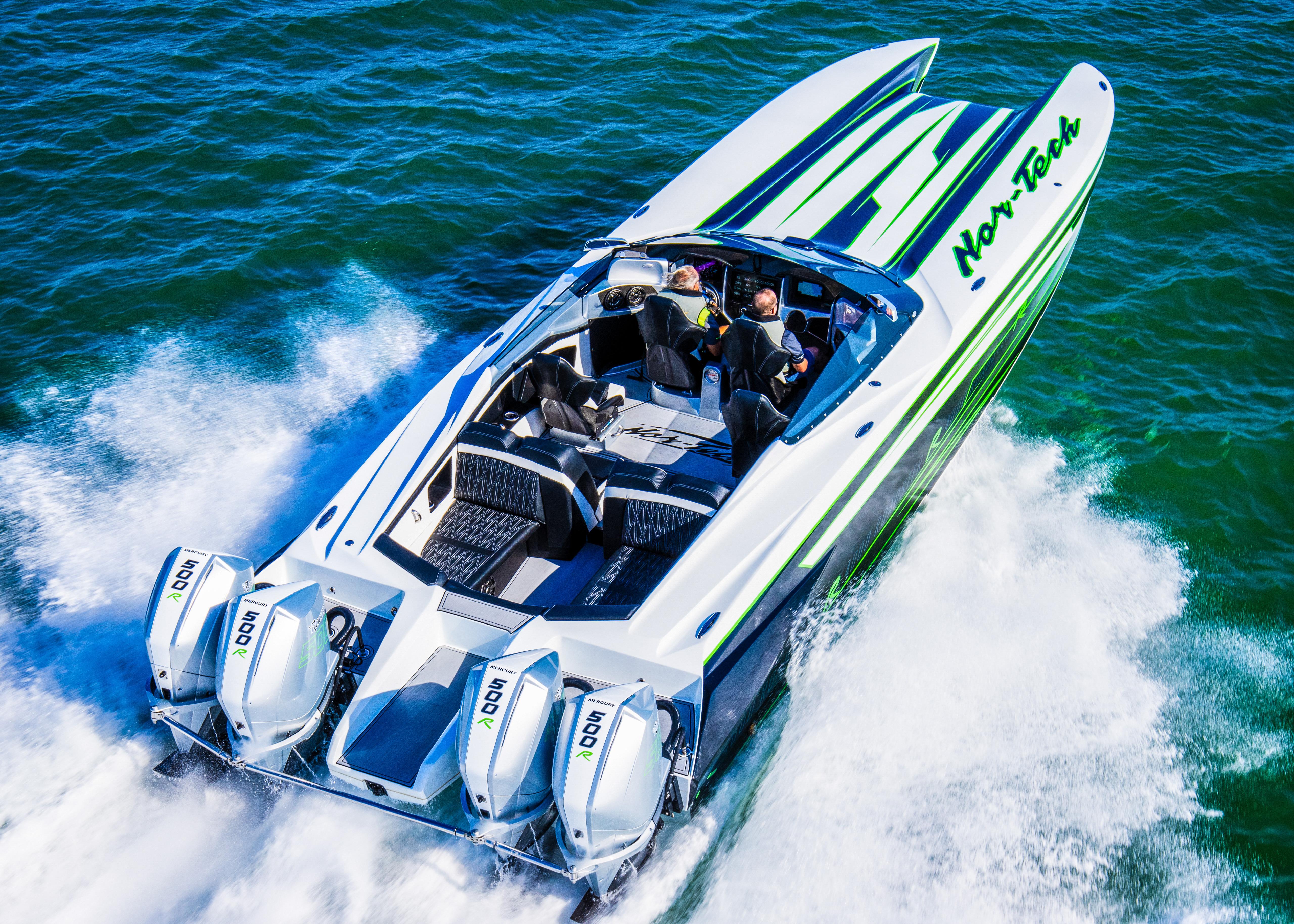 2025 Nor-Tech 4000 Supercat speedboat cruising on water, featuring sleek design and powerful engines.