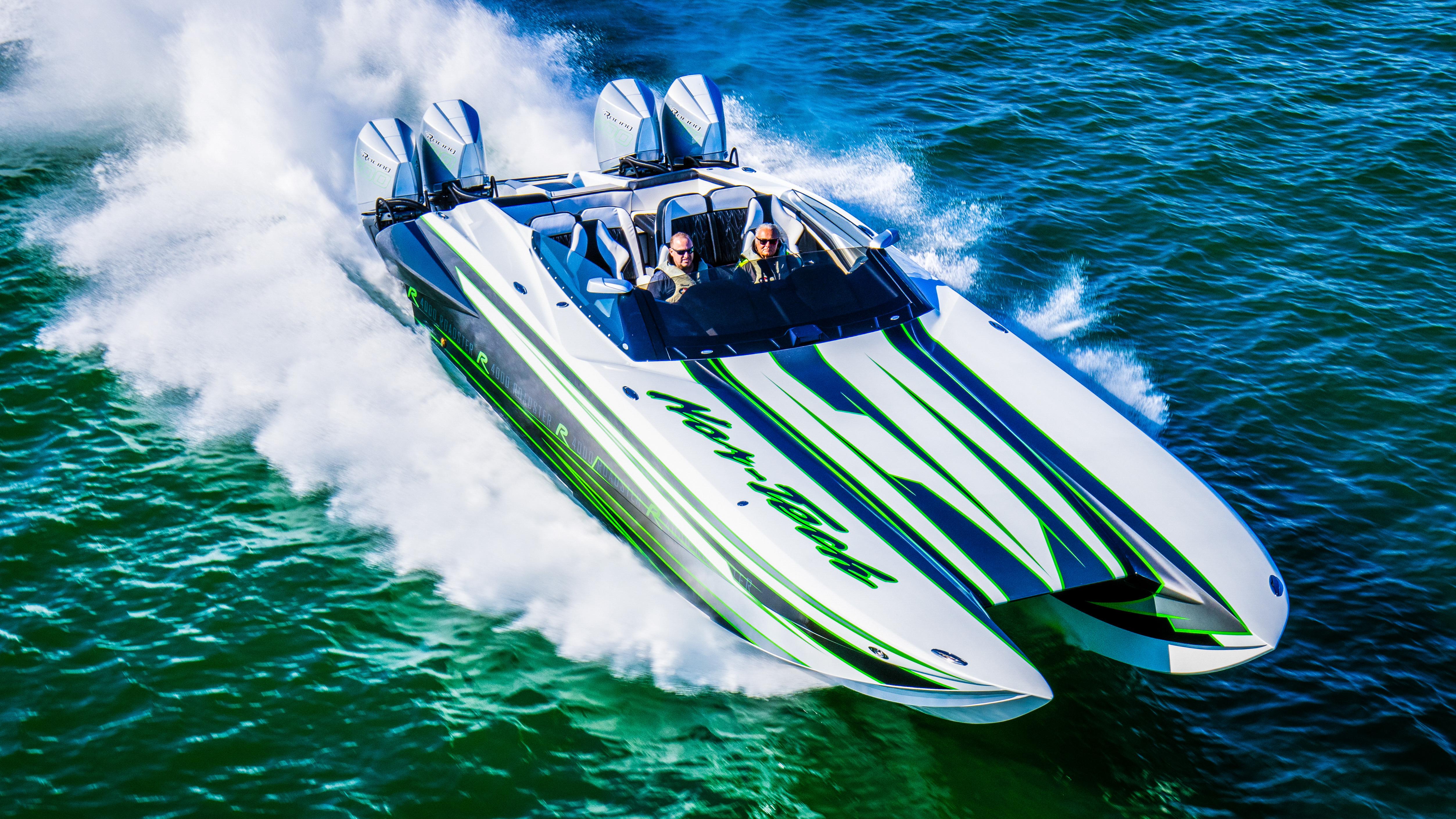 2025 Nor-Tech 4000 Supercat speedboat racing on water, showcasing sleek design and powerful engines.