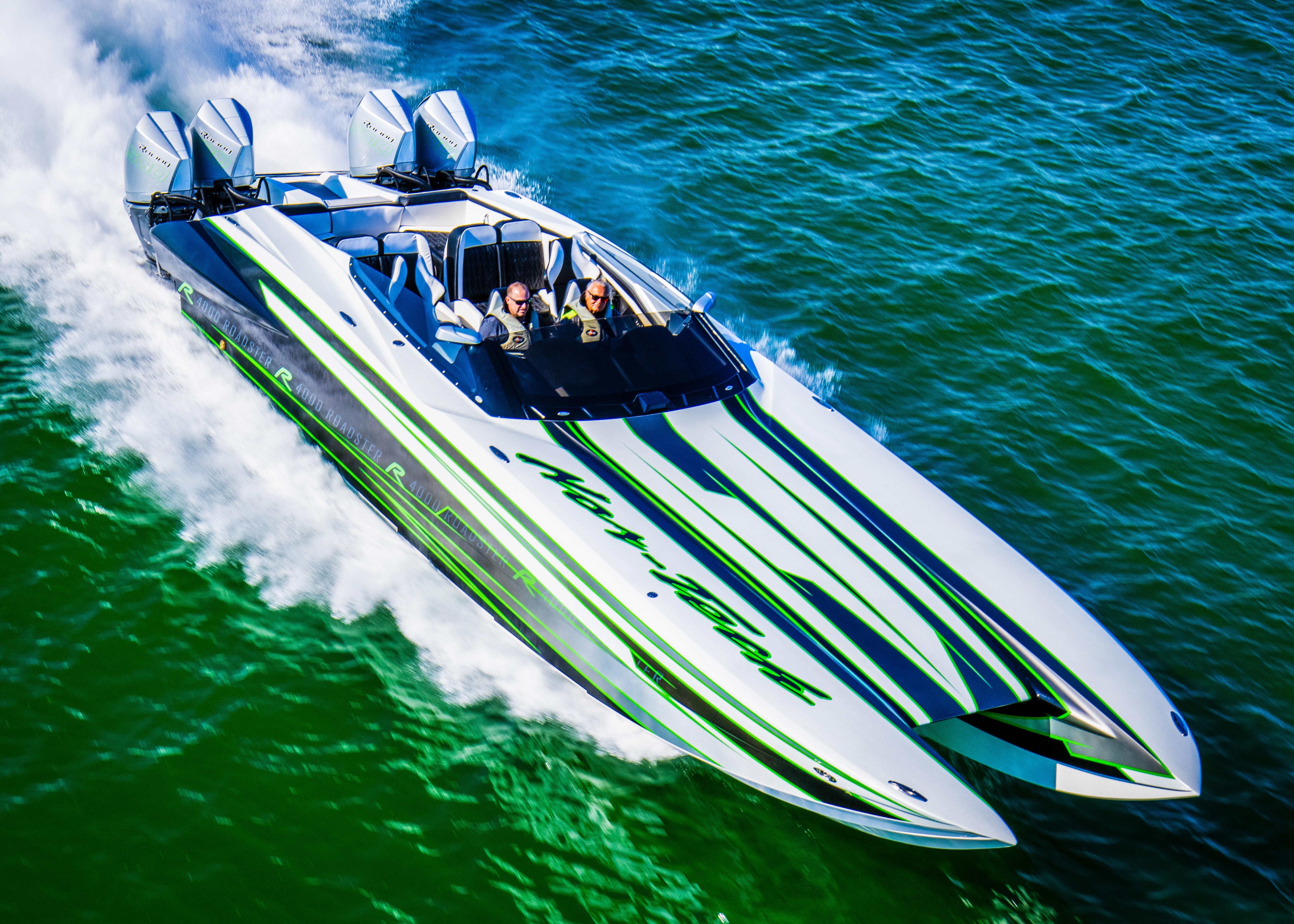 2025 Nor-Tech 4000 Supercat speedboat cruising on vibrant blue water.