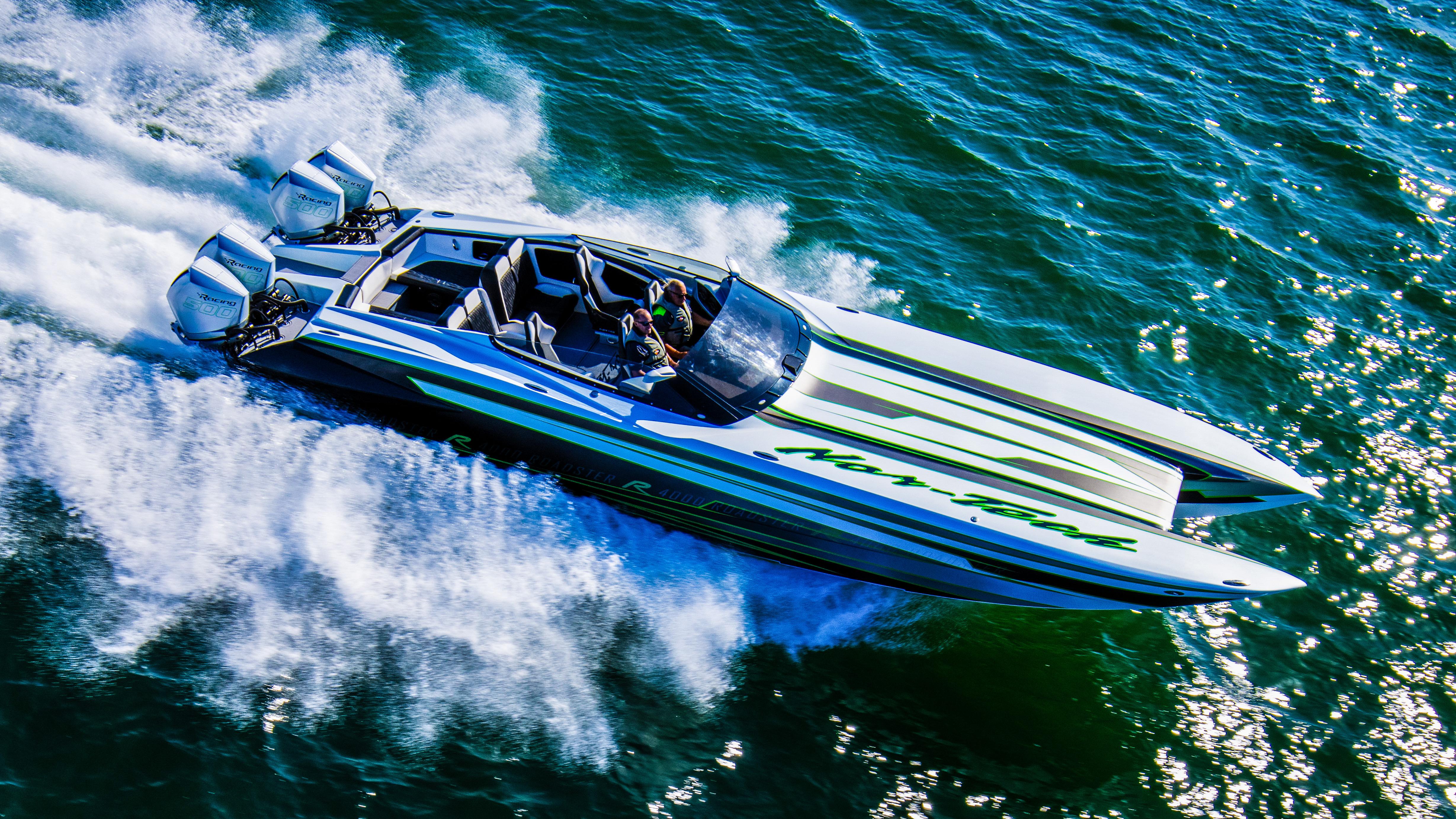 Nor-Tech 4000 Supercat 2025 speeding on water, showcasing sleek design and powerful engines.
