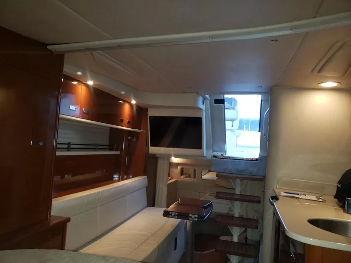 Sol Searching Yacht Photos Pics Interior of 2011 Sea Ray 350 Sundancer yacht with modern amenities and wooden finishes.