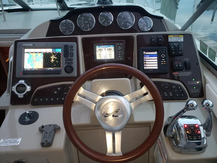 Sol Searching Yacht Photos Pics Helm of 2011 Sea Ray 350 Sundancer with navigation and control systems.