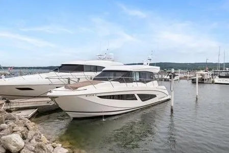 2018 Regal 42 Grand Coupe Yacht Photos Pics 2017 Regal 42 Grande Coupe yacht docked at a marina under a clear blue sky.