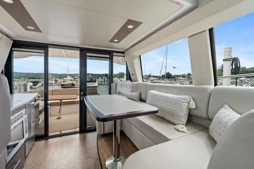 2018 Regal 42 Grand Coupe Yacht Photos Pics Luxurious interior of 2017 Regal 42 Grande Coupe yacht with elegant seating and scenic views.