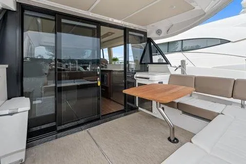 2018 Regal 42 Grand Coupe Yacht Photos Pics 2017 Regal 42 Grande Coupe yacht with spacious outdoor seating and sliding glass doors.