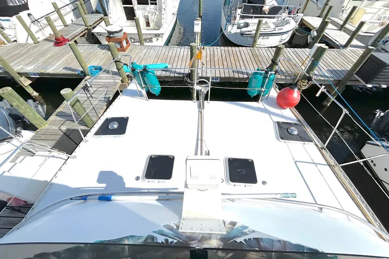 Seahawk Yacht Photos Pics 2004 PDQ 34 Power Catamaran docked at marina, top view showing deck and hatches.