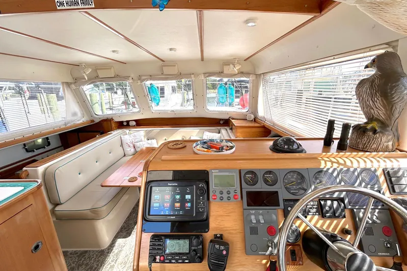 Seahawk Yacht Photos Pics Interior of 2004 PDQ 34 Power Catamaran with helm, seating, and decor.