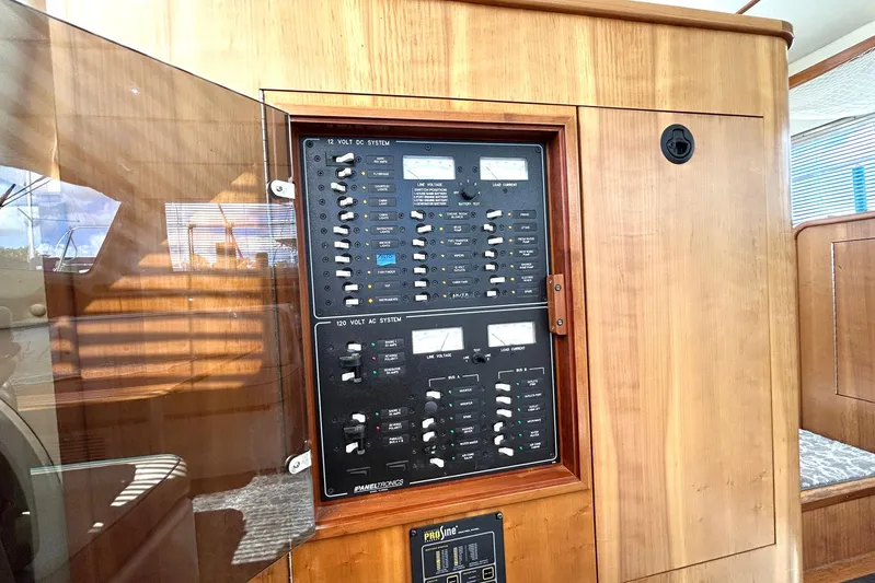 Seahawk Yacht Photos Pics Electrical panel on 2004 PDQ 34 Power Catamaran, featuring 12V DC and 120V AC systems.