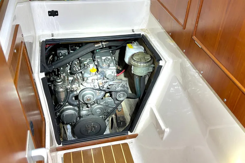 Seahawk Yacht Photos Pics Engine compartment of 2004 PDQ 34 Power Catamaran with visible mechanical components.