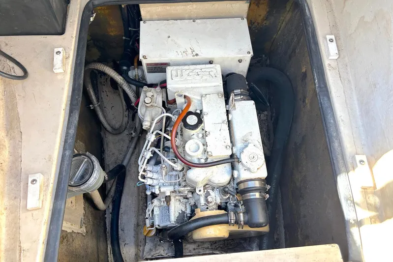 Seahawk Yacht Photos Pics Engine compartment of a 2004 PDQ 34 Power Catamaran, showcasing mechanical components and wiring.