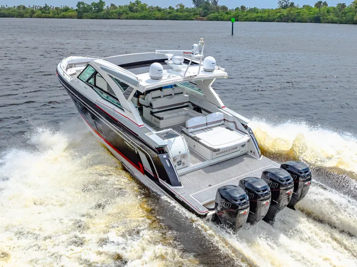 Ski 2 Sea Yacht Photos Pics 2017 Formula 430 Super Sport Crossover boat cruising on water with four outboard engines.