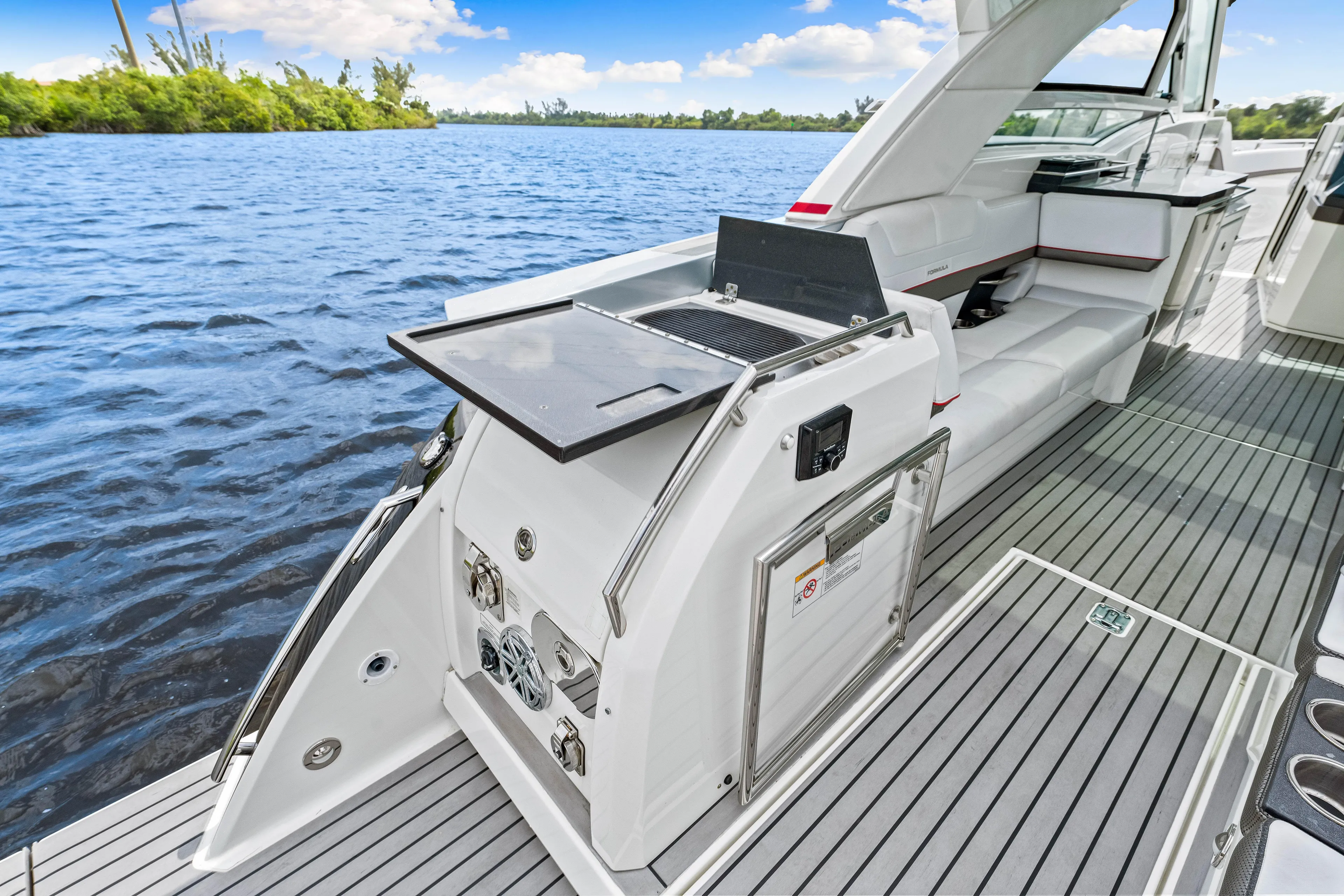 Ski 2 Sea Yacht Photos Pics 2017 Formula 430 Super Sport Crossover yacht with outdoor kitchen on a serene lake.