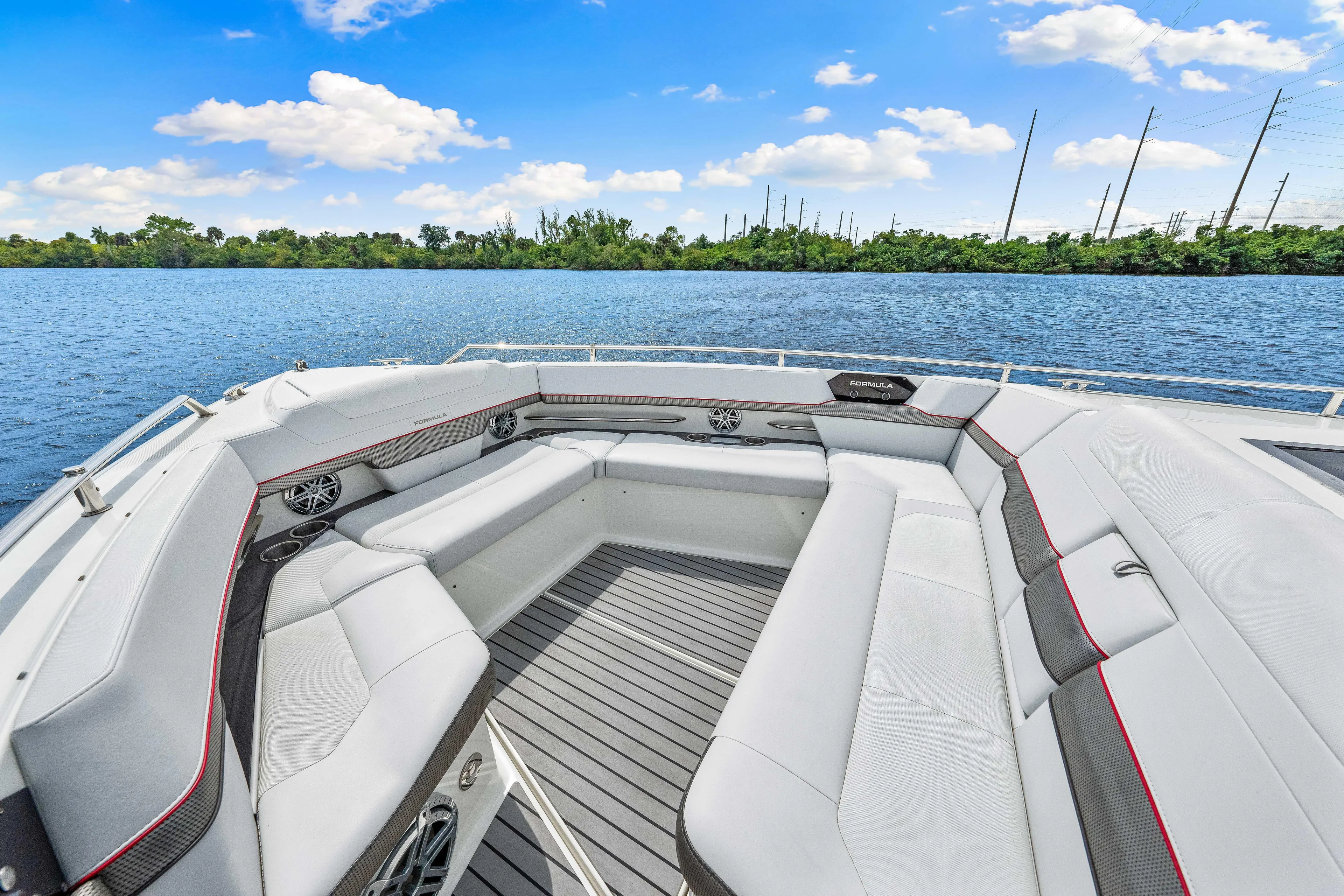 Ski 2 Sea Yacht Photos Pics 2017 Formula 430 Super Sport Crossover boat with spacious seating on a serene lake.