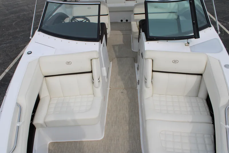  Yacht Photos Pics 2020 Cobalt R30 boat interior with white leather seating and dual windshields.