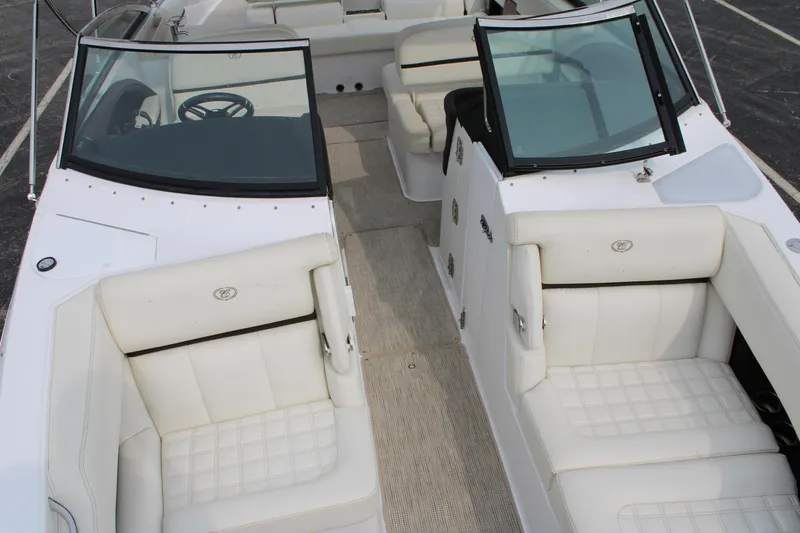  Yacht Photos Pics 2020 Cobalt R30 boat interior with white leather seating and dual windshields.