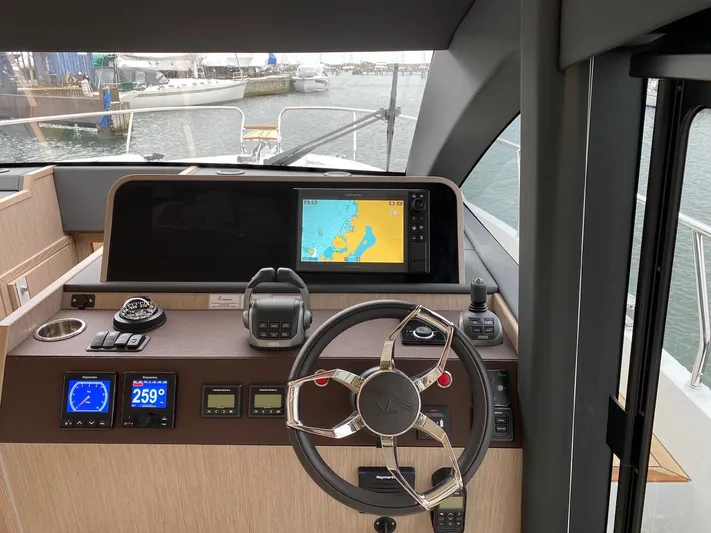 Sealine F430 Yacht Photos Pics Helm of 2025 Sealine F430 yacht with navigation display and controls.